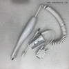 Green color dental chair unit with dental air compressor and dental handpiece