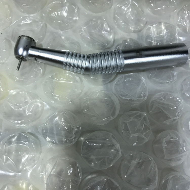 A Dental Fiber Optic High Speed Turbine 660B Led Handpiece with Quick Connector