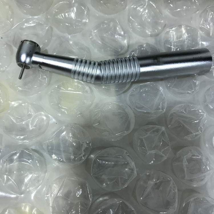 A Dental Fiber Optic High Speed Turbine 660B Led Handpiece with Quick Connector